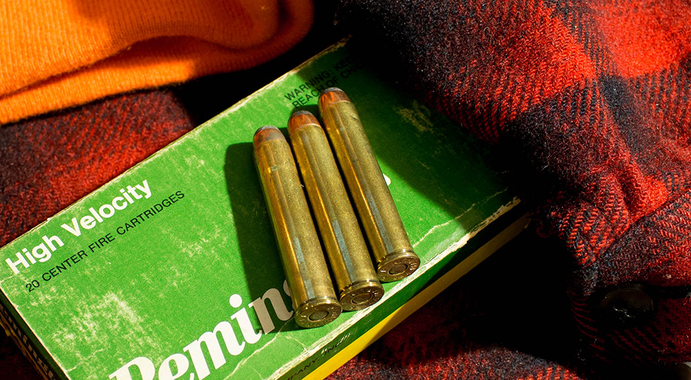 Remington High Velocity 444 Marlin ammunition on Buffalo check red wool jacket.