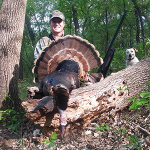 Hunter with wild turkey in Oklahoma