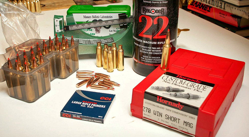 Ammunition reloading supplies on plastic table.