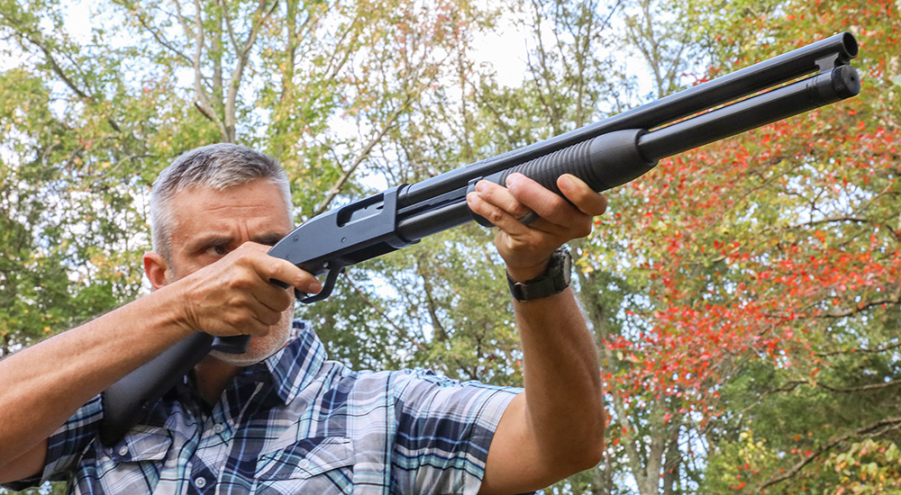 Male shooting Maverick 88 Security 12-gauge shotgun.
