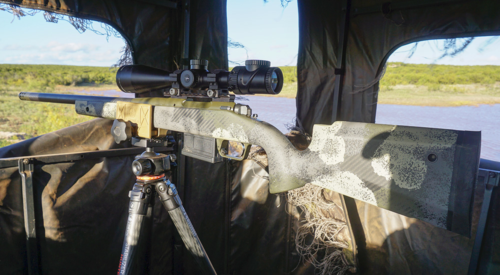 Springfield Model 2020 Waypoint rifle on tripod in hunting blind.