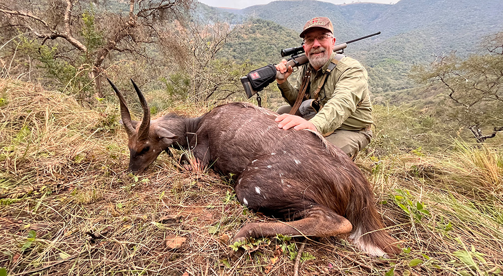 Hunter with bushbuck in South Africa.