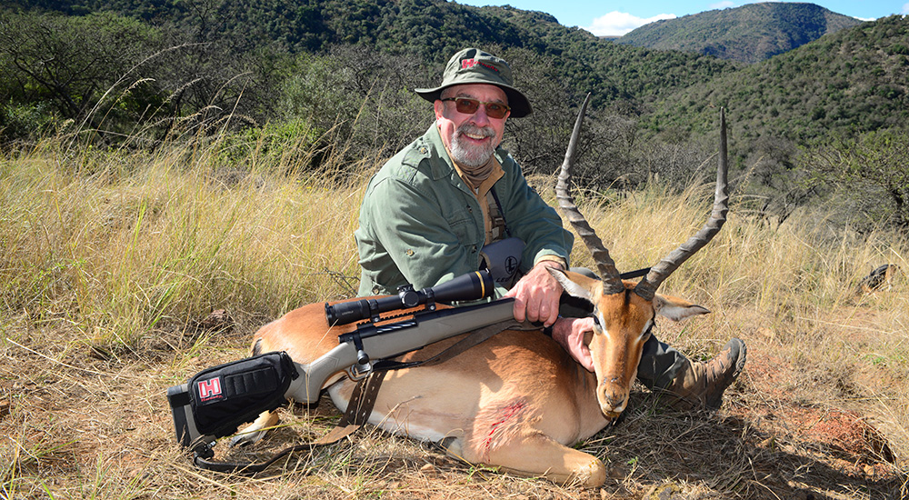 Hunter with impala in South Africa.
