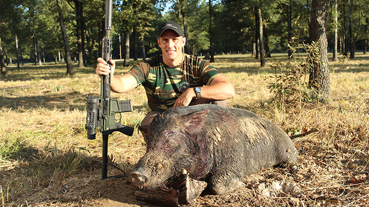 Hunter with Feral Hog in Texas