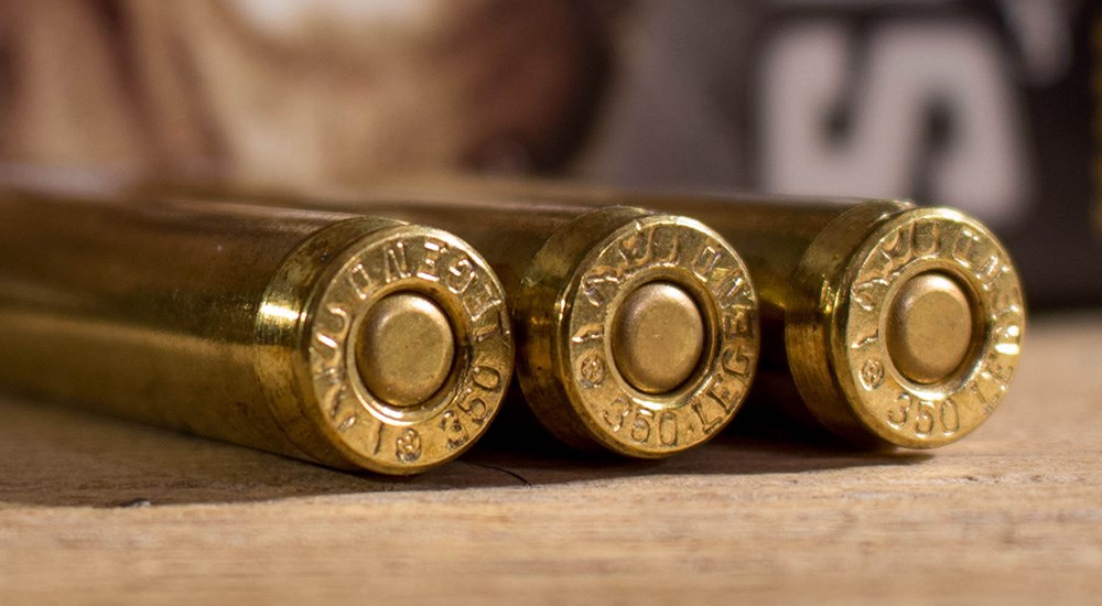 Three 350 Legend ammunition cartridges side-by-side showing head stamp.