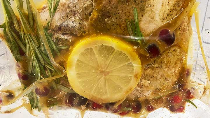 Sous Vide Wild Turkey Breast with Lemon, Rosemary and Cranberries, sealed for cooking
