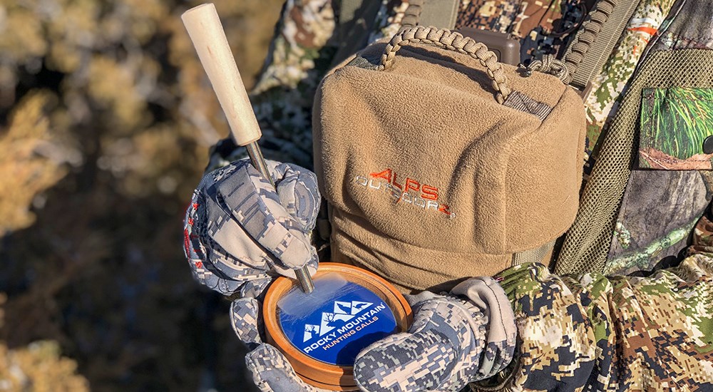 Hunter using turkey call.
