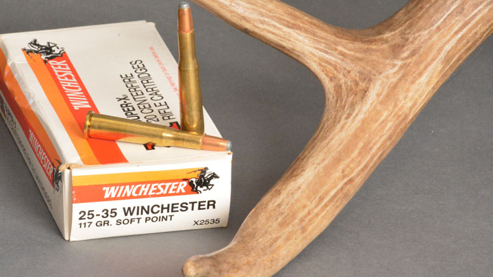 .25-35 Winchester Sitting on a box, in the crook of a deer antler