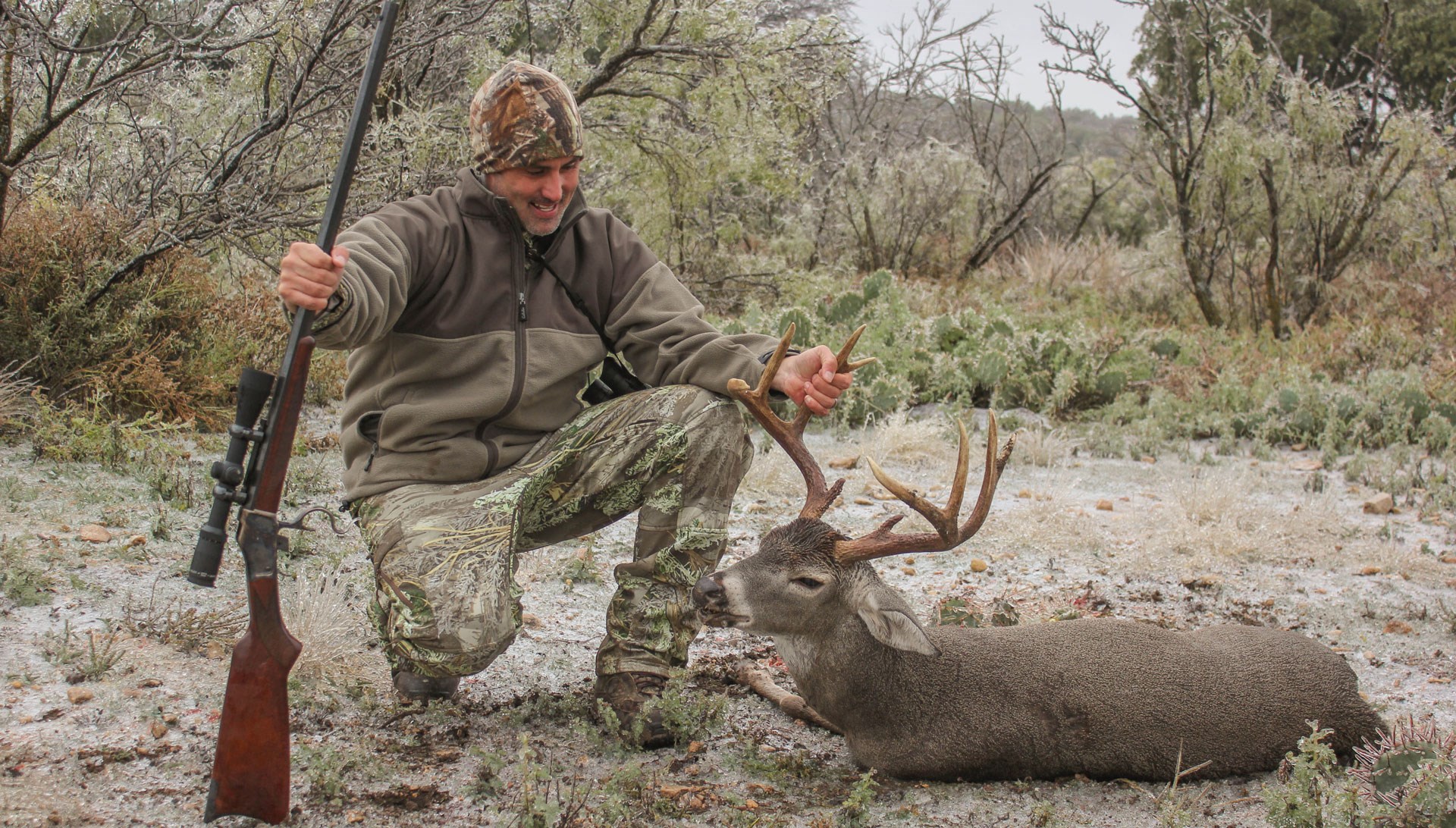 Hunter poses with classic rolling block .45-70 government over dead buck