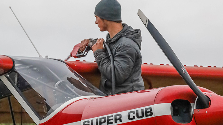 Pilot Adding Fuel to Bush Plane