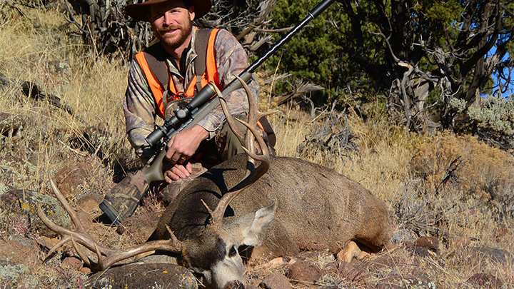 Hunter with Mule Deer taken with .280 Ackley Improved