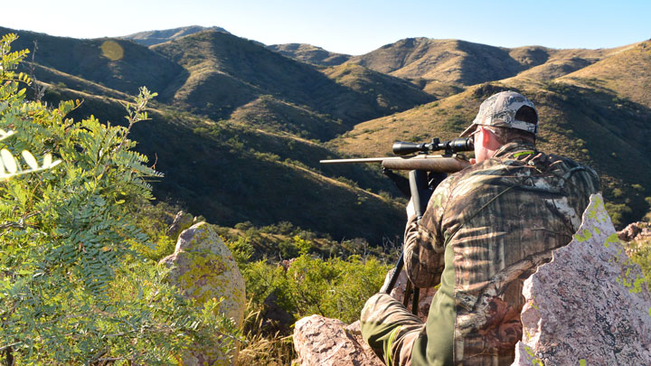 Hunter on rifle lining up a shot