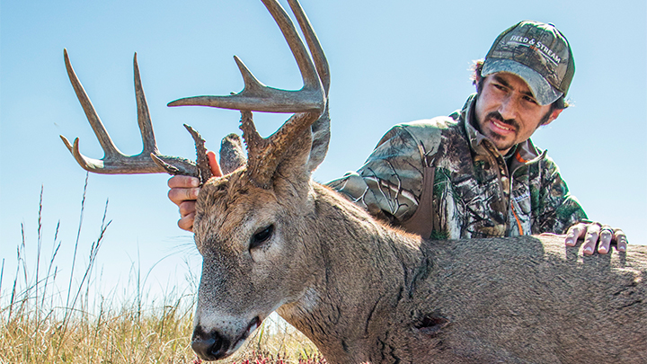 Hunter with Whitetail Buck