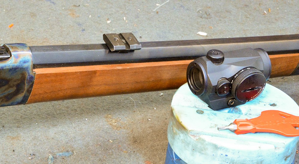 Lever action rifle with Burris FastFire 4 red dot optic to be mounted on barrel.