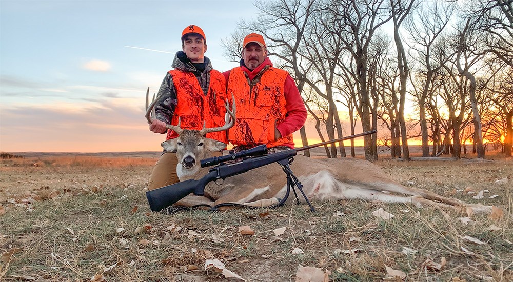 Hunters with whitetail buck in Nebraska Sandhills