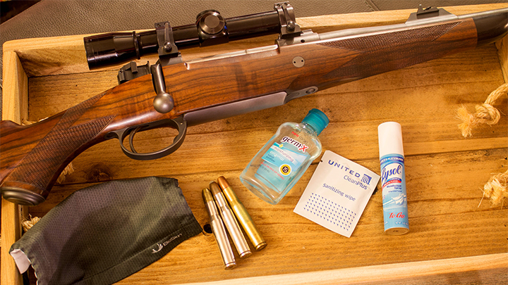 Essential Items for Traveling to Hunt Rifle, Ammunition, Hand Sanitizer, Mask