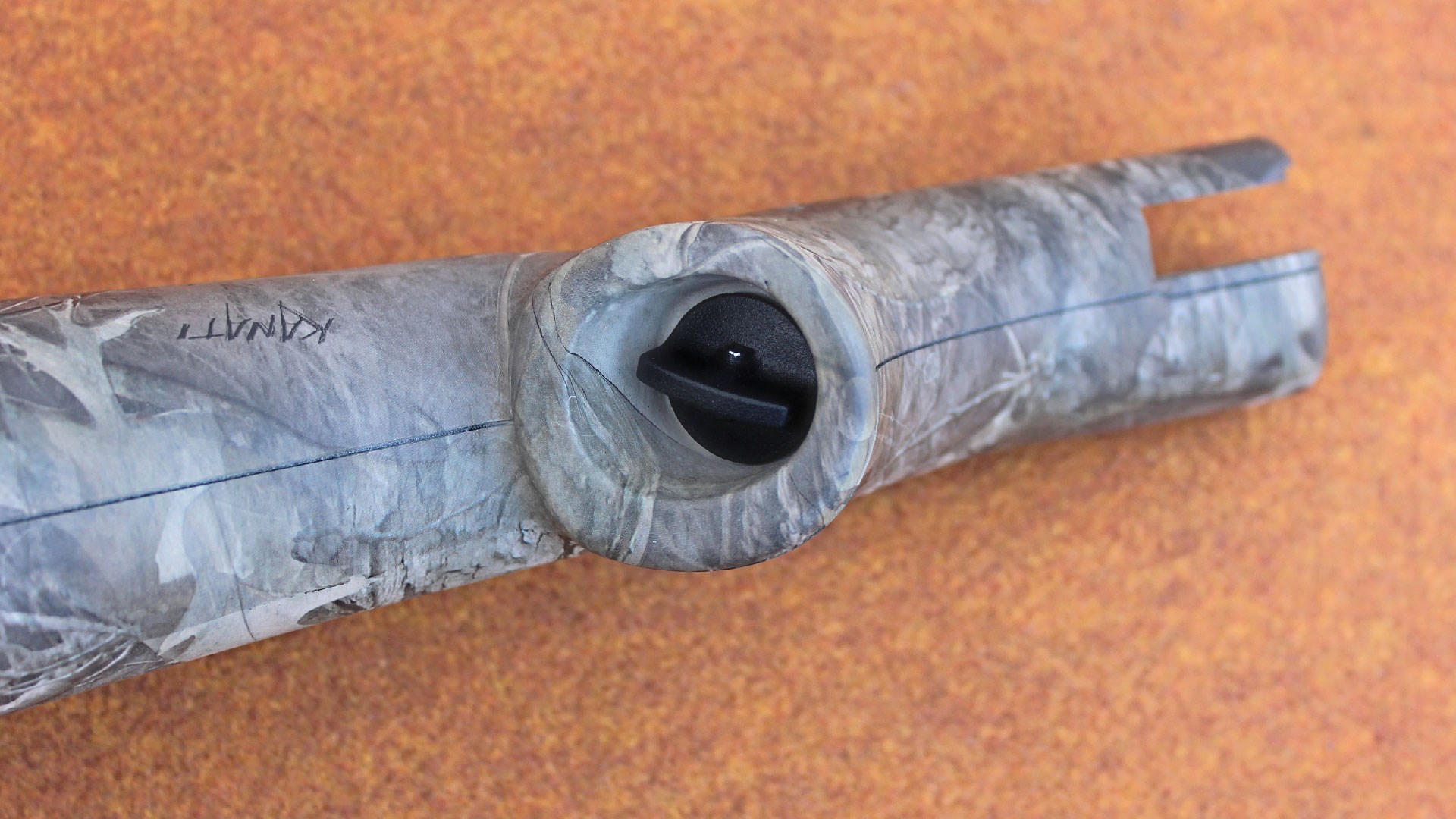 Receiver screw inside stock grip