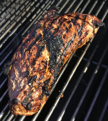 Meat cooking on a grill.