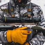 Man Holding Rifle Lede