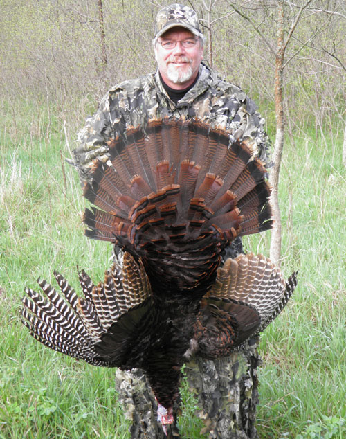 Author holding a gobbler.