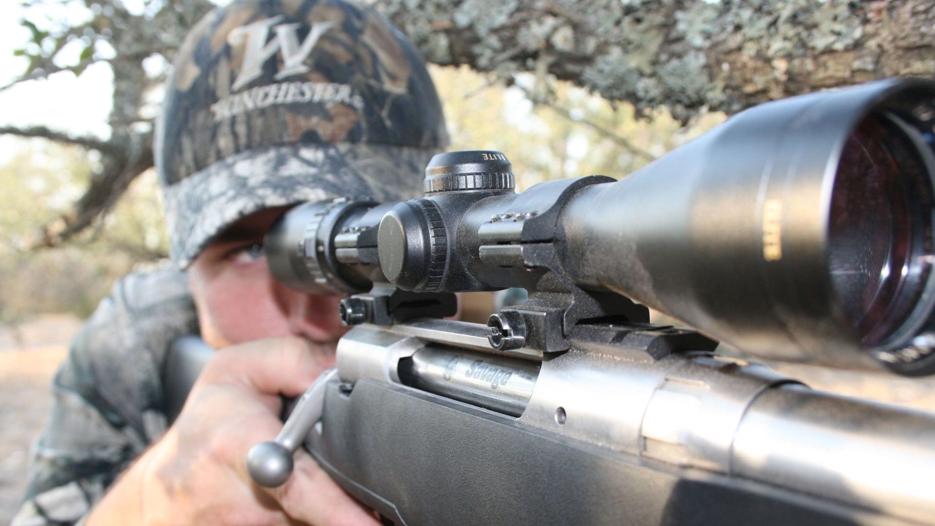 Hunter looking through scope