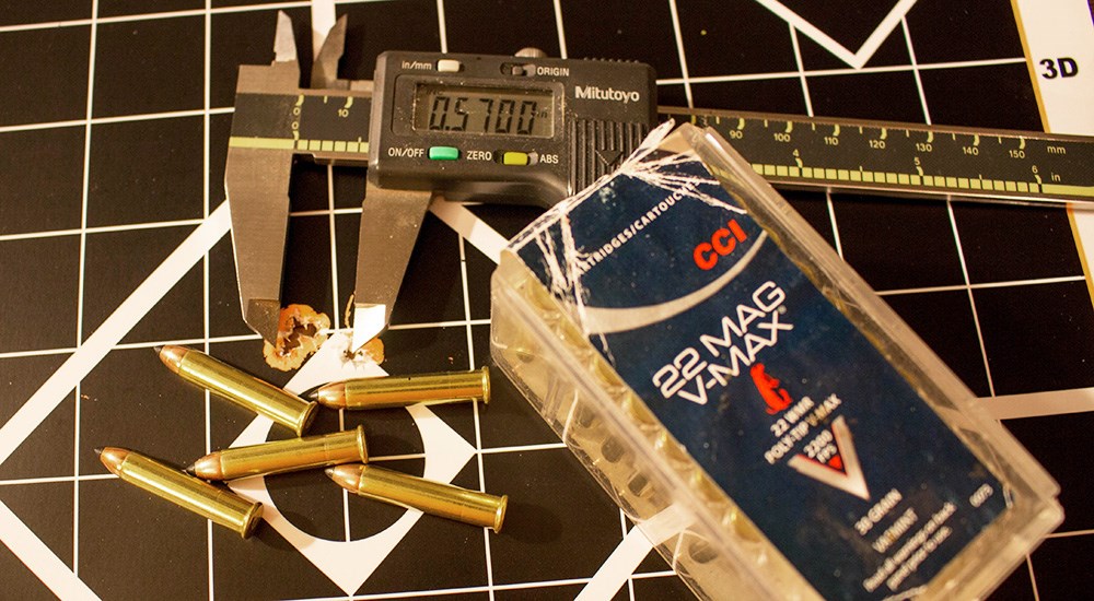 CCI .22 Magnum V-Max ammunition on target with measuring stick to measure bullet holes.