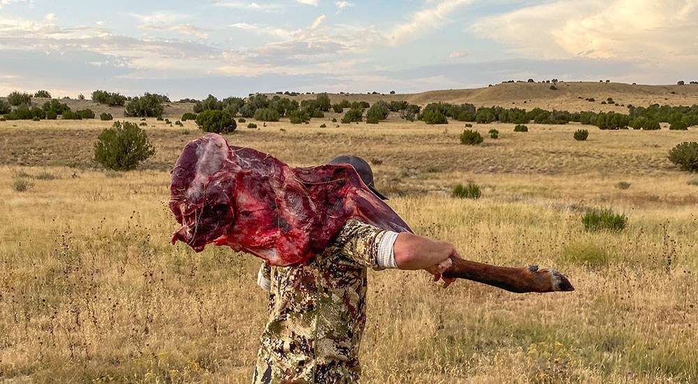 Hunter Carrying Butchered Elk Meat
