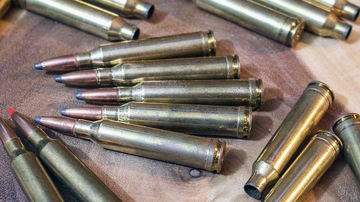 7mm Remington Magnum Ammunition and Cases on Table
