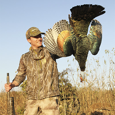 Author holding ocellated turkey taken in Mexico