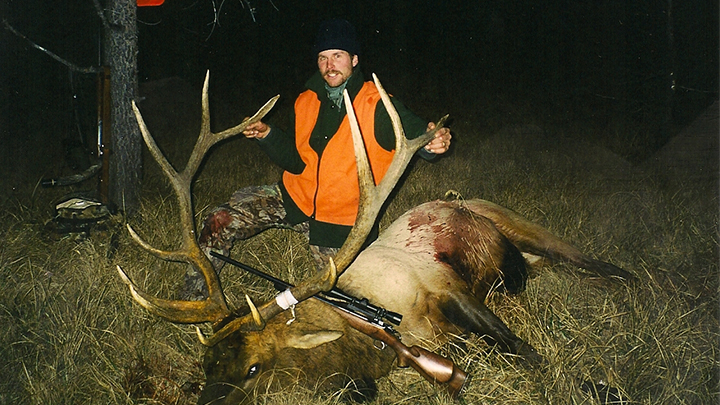 Hunter with bull elk