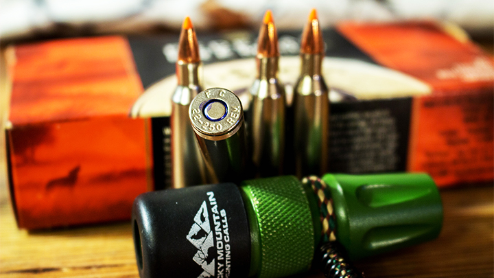 .22-250 Remington ammunition on table with predator call