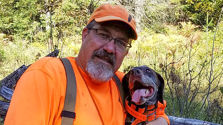 Hunting Dog Trainer Posing with Dog