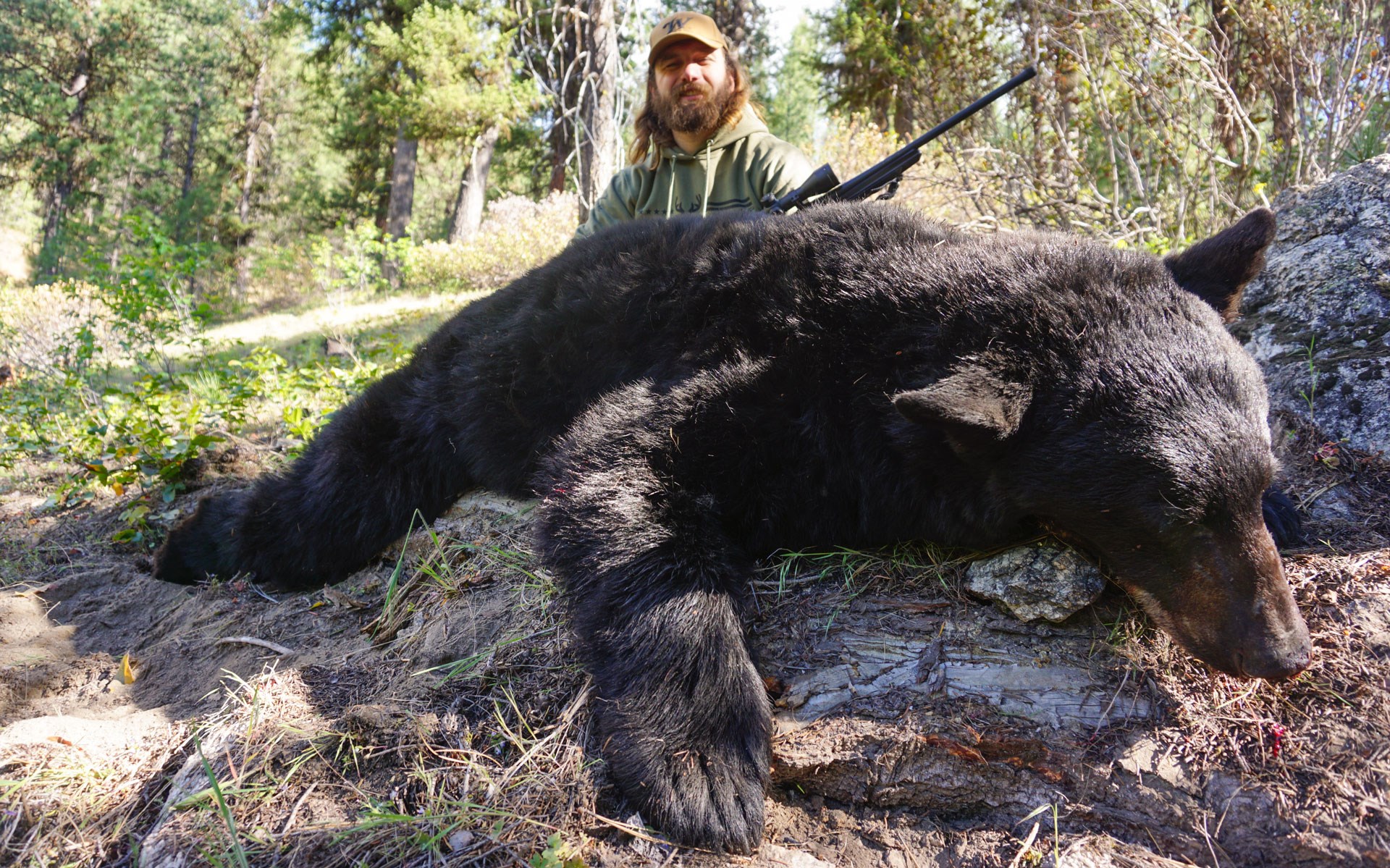 Hunter with black bear