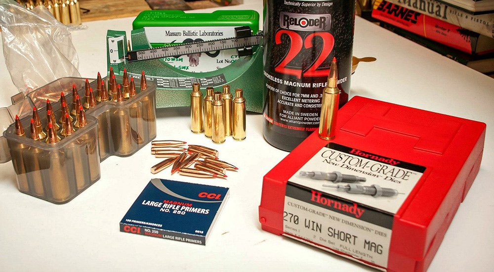Ammunition reloading supplies on plastic table.