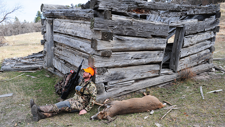 Hunter with Whitetail deer