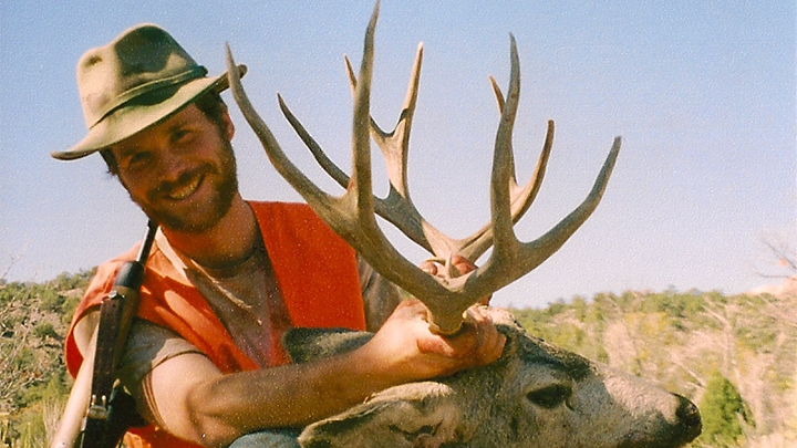 Hunter with Mule Deer Buck