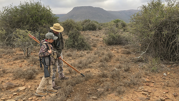 Father and son on African safari