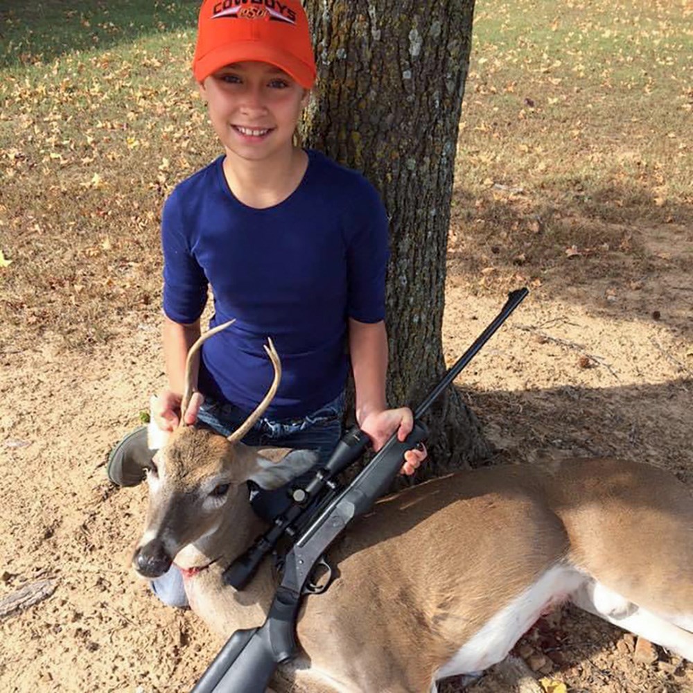 Young Female Hunter with whitetail buck in Oklahoma