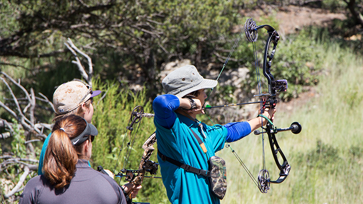 Youth Improving Compound Bow Skills at NRA Youth Hunter Education Challenge