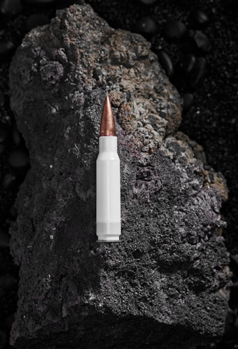 Single round of true velocity, with a white case and a no green tip, on a rock.