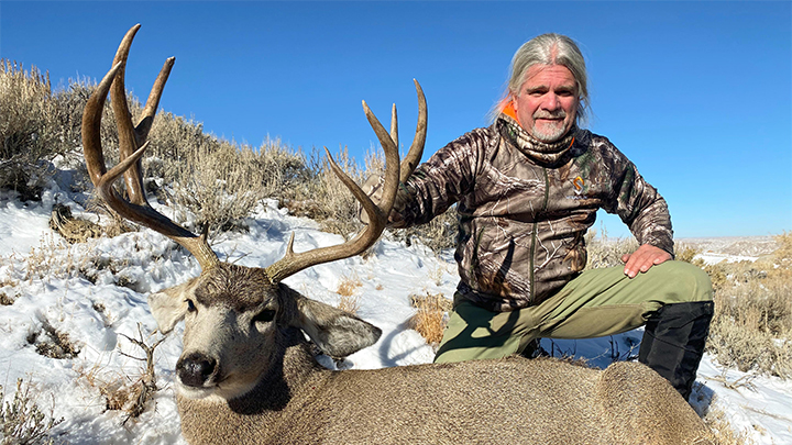 Hunter with Colorado Mule Deer