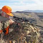 Hunter Shooting Down A Hill