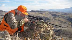 Hunter Shooting Down A Hill