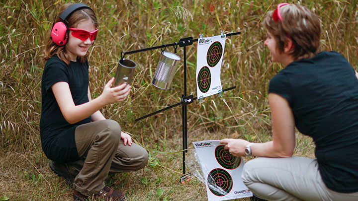 Woman and young girl viewing practice targets