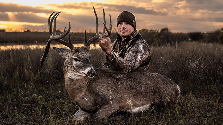 Kansas bowhunter with whitetail deer