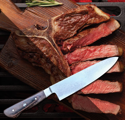 30th Anniversary Limited Edition Chef knife lifestyle shot on steaks