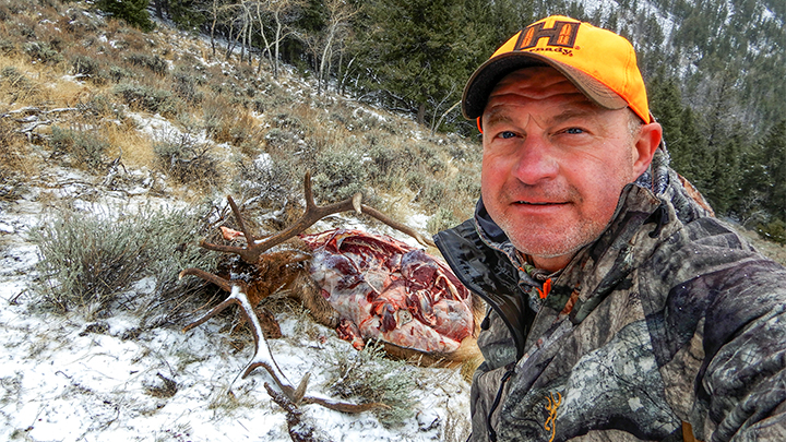 Hunter skinning elk taken in Wyoming