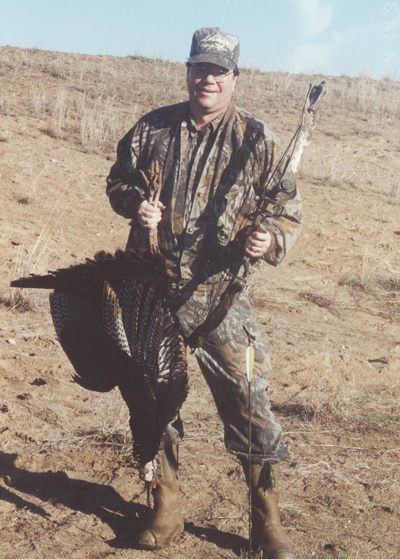 Bowhunter with bird