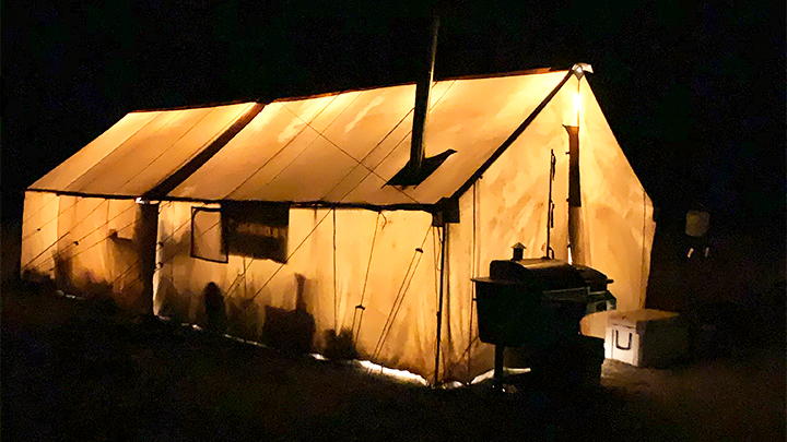 Wall Tent Illuminated at Night in Wyoming