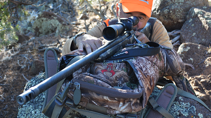 Hunter shooting rifle